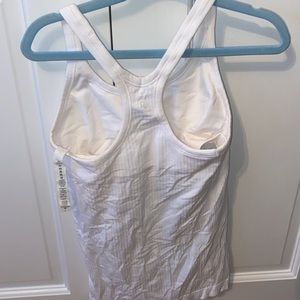 Lululemon Woman’s EBB to street Shelf bra White tank top size 4 .